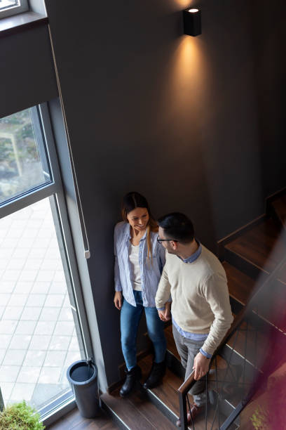 istock Couple walking down the restaurant stairs 1144883956