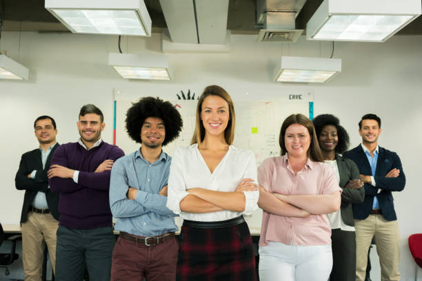 istock Group of workers standing in an office 1144886185