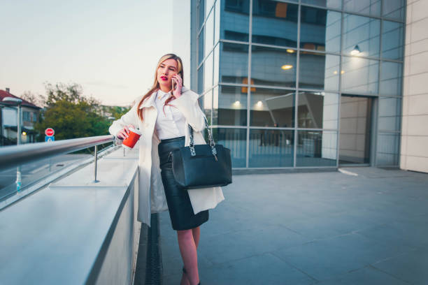 istock Business woman talking on mobile phone 1144889487