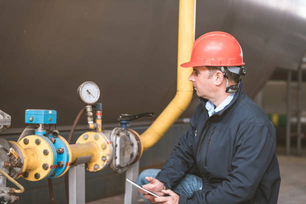 istock Engineer is Controlling the Work of Heating Plant on his Tablet 1144896493