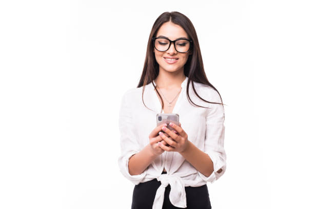 istock Business woman texting on her mobile phone isolated over white background 1144906401