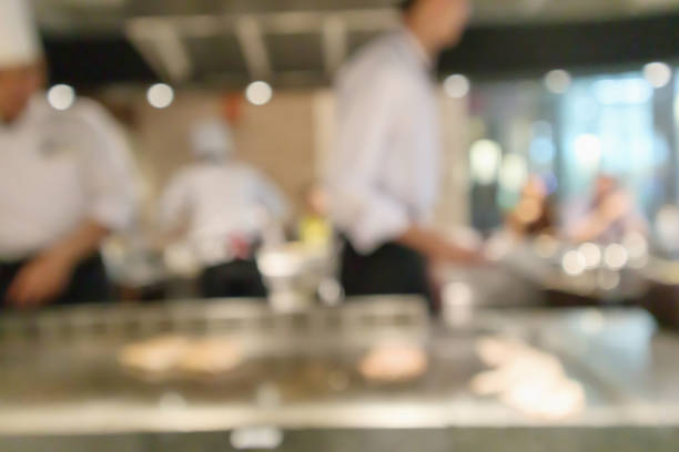 istock Chef cooking in restaurant kitchen blurred defocused background 1144910177