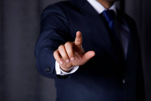 istock Business man touching imaginery screen 1144912977