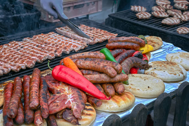 istock Assorted delicious grilled meat with vegetables over the coals on a barbecue 1144913092