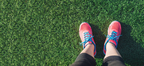 istock Female jogger looking down at her feet 1144922785