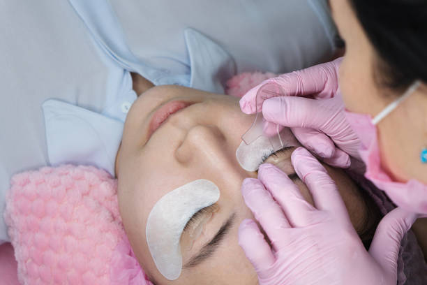 istock Eyelash Extension Procedure. Woman Eye with Long Eyelashes 1144924618