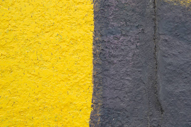 istock Two-tone stone wall - black and yellow. 1144926843
