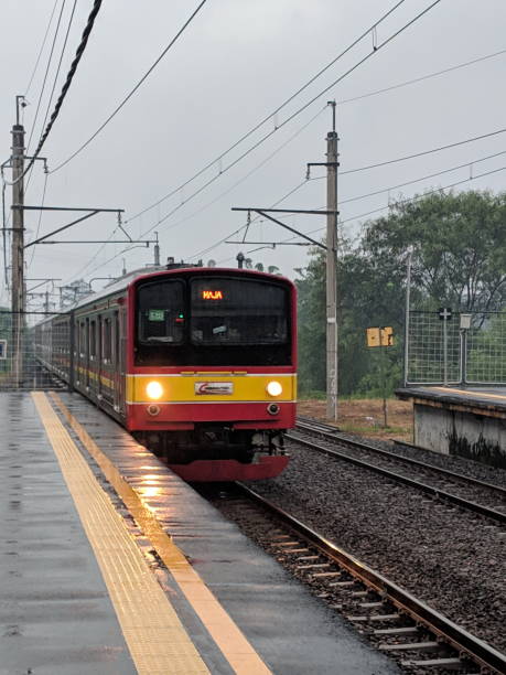 Cisauk Station in Serpong Serpong, Indonesia - April 7, 2019: A commuter line train arrives at Cisauk Station. tangerang photos stock pictures, royalty-free photos & images