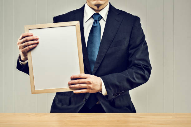 istock Businessman holding a board in his hand 1144933448