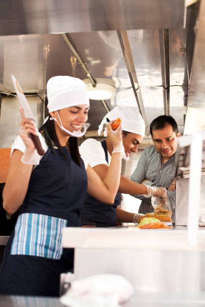 istock Workers cook on the food truck while the boss supervises them 1144933534