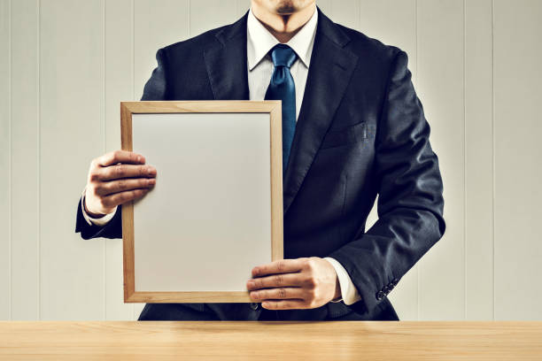 istock Businessman holding a board in his hand 1144933538
