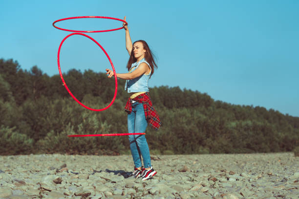 istock girl with hoops in nature 1144935009