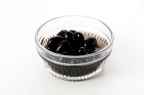 istock boiled black beans in glass bowl on white background 1144936006