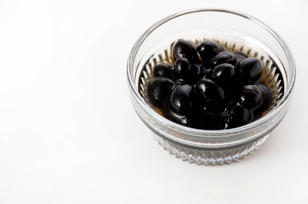 istock boiled black beans in glass bowl on white background 1144936566