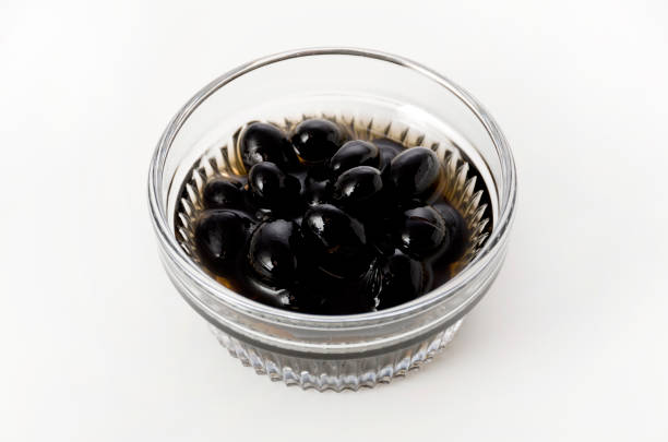 istock boiled black beans in glass bowl on white background 1144936609