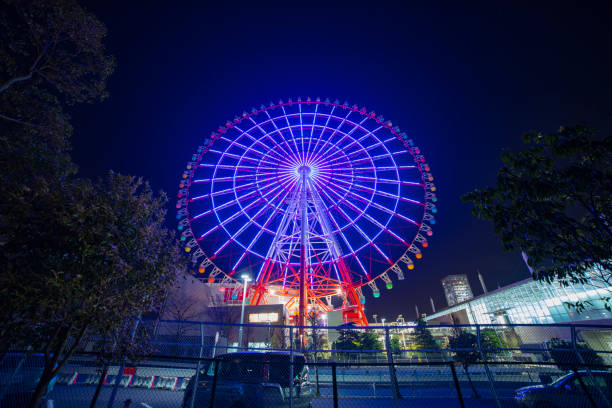 Time lapse ferris wheel at the amusement park at night. Koutou-ku Odaiba Tokyo Japan - 01.08.2019 : It s a ferris wheel at night. camera : Canon EOS 5D mark4