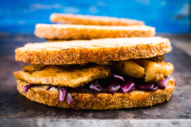 istock Freshly cooked sandwiches with roasted chicken, purple cabbage and mushrooms 1144940422