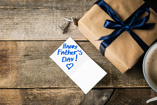 Fathers day concept - present, coffee, tie, mustache copy space