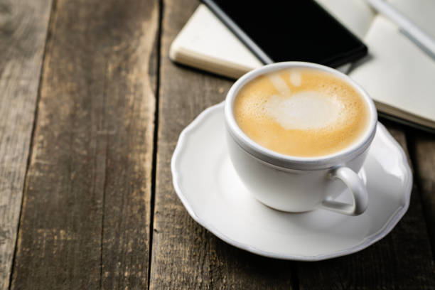istock BUsiness morning concept - coffee, notebook, phone 1144957415