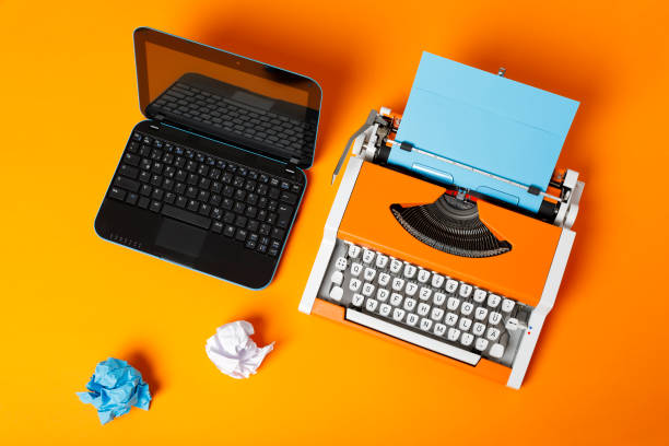 istock Digital and analog – Laptop and 70s Typewriter 1144959134