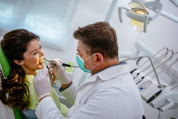 istock Young woman at dentist's office replacing fillings 1144963033