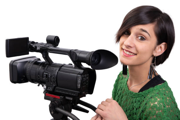 istock smiling young woman with professional video camera, isolated on white background 1144963096