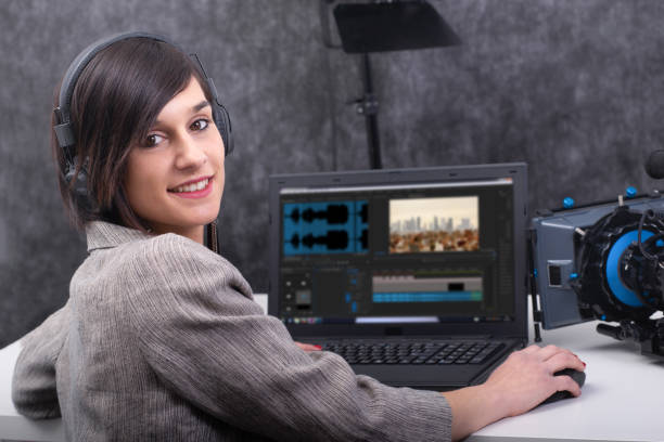 istock smiling young woman video editor working in studio 1144963364