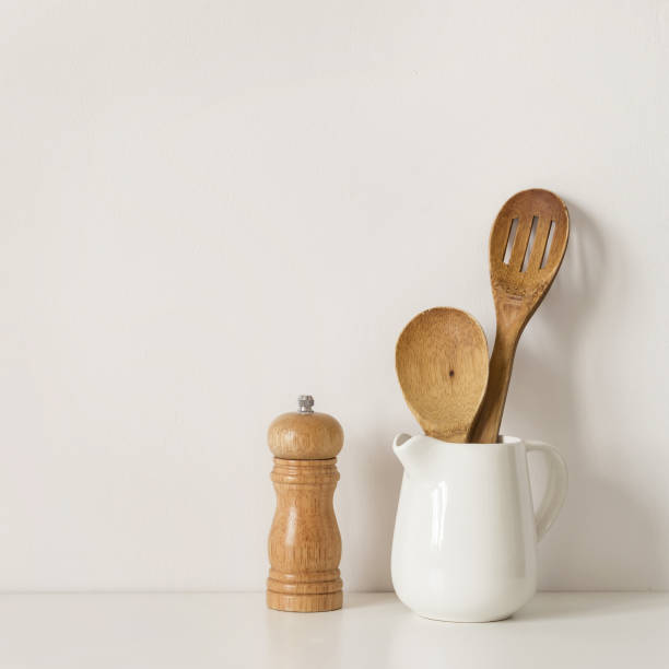 istock Kitchenware spoons and spice mill on table wall background. Recipe Template mockup 1144963581