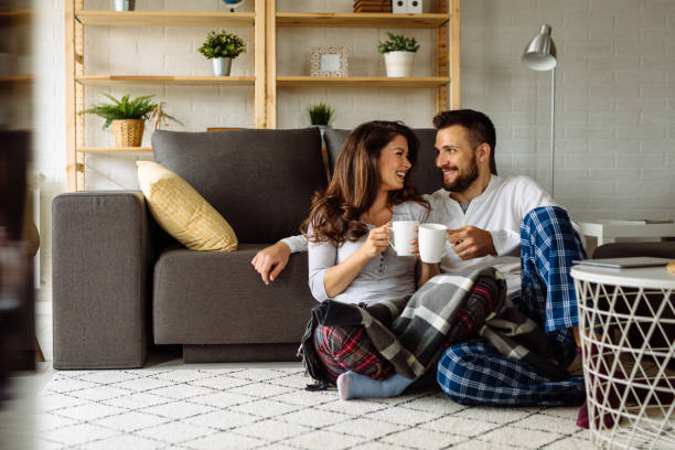 istock Loving couple relaxing at home 1144963595