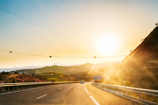 istock Road By Mountains Against Sky During Sunset 1144967902