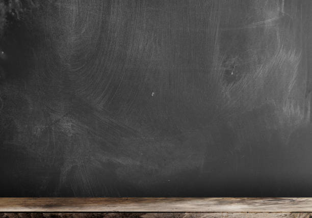 istock smudged blackboard or chalkboard background with wooden tray 1144971764