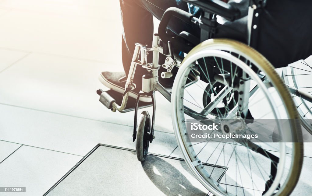 Your independence is assured! Closeup shot of an unrecognizable man sitting in a wheelchair Wheelchair Stock Photo