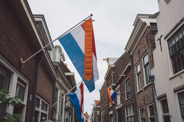 istock Low Angle View Of Flags On Buildings Against Sky 1144972538