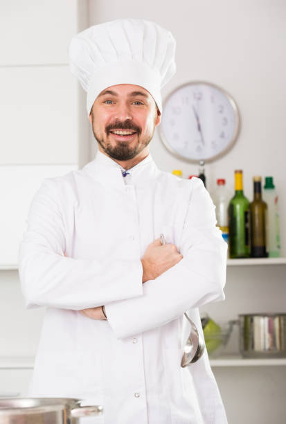 istock Male cook preparing food 1144974612