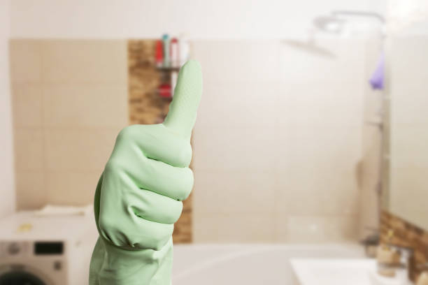 istock Person showing thumb up as cleaning bathroom 1144980911