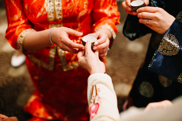 istock Newlywed serving tea to elder on Chinese traditional tea ceremony 1144984584