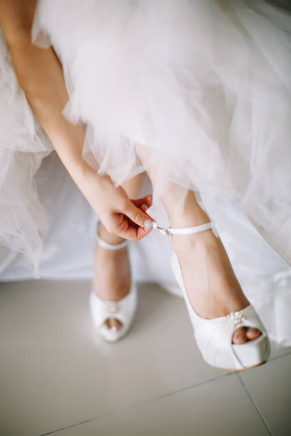 istock Bride wearing wedding heels on wedding day 1144984675