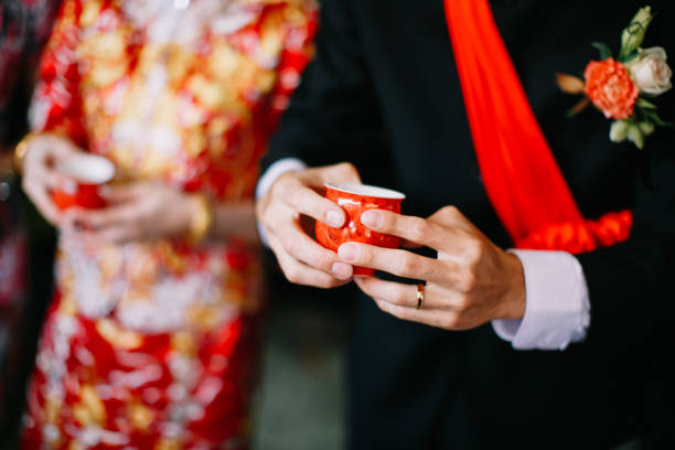 istock Newlywed serving tea to elder on Chinese traditional tea ceremony 1144984716