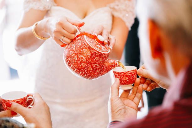 istock Newlywed serving tea to elder on Chinese traditional tea ceremony 1144984734