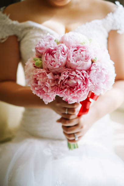 istock Bride with flower bouquet 1144984767