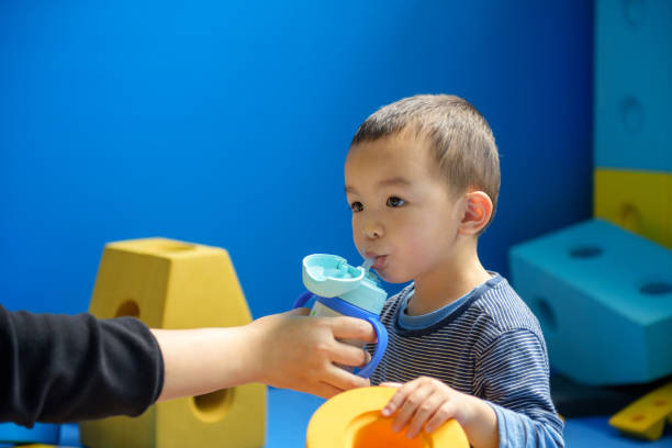 Asian baby boy in indoor playground stock photo