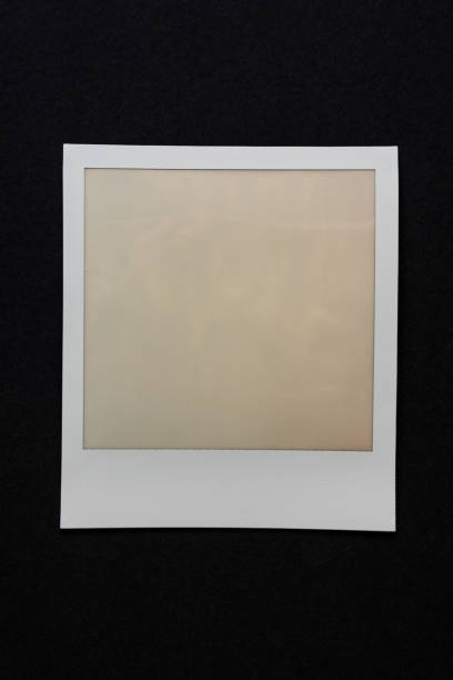 istock single instant photo film frame on dark background 1144987692