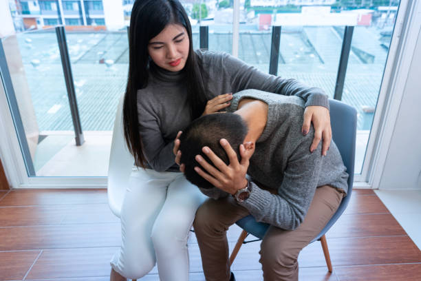 istock Young nervous couple talking with psychologist. Psychologist taking notes and explaining something to them 1144987812