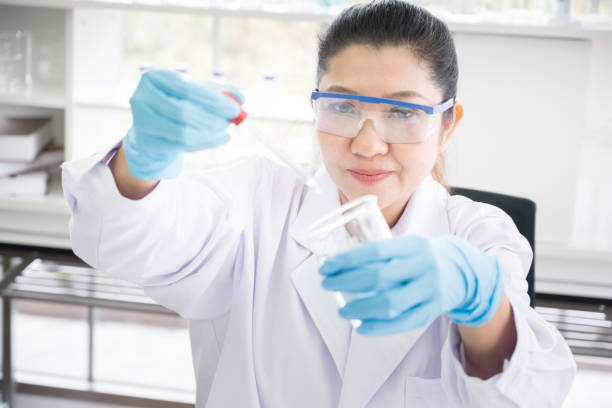 istock Asian scientist in the laboratory working at lab with test tubes concept 1144988323