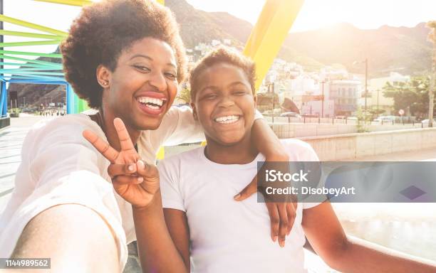 Happy Young Mother Having Fun With Her Child In Summer Sunny Day Son Taking Selfie With His Mum Outdoor Family Lifestyle Motherhood Love And Technology Concept Main Focus On Woman Face Stock Photo - Download Image Now
