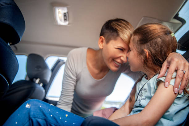 istock Happy Mother and her daughter before the road trip in the car 1144989607