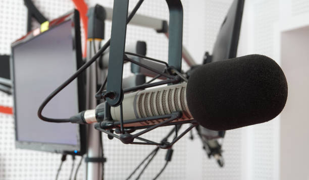 istock Microphone music in audio studio or radio show 1144994056
