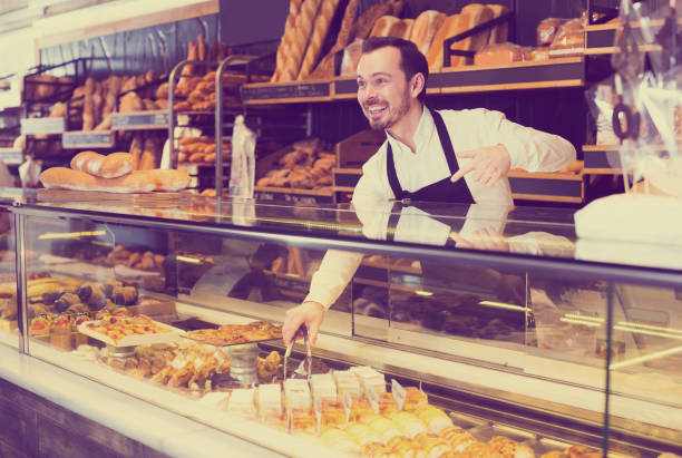 istock Seller offering fresh tasty bun 1144994552