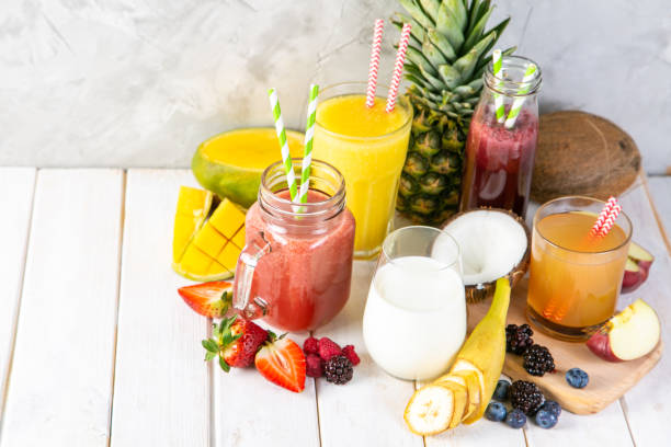 istock Selection of colourful smoothies in glasses with ingredients 1144998525