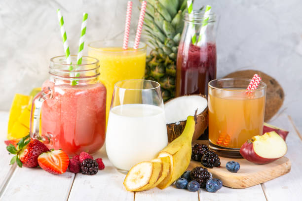istock Selection of colourful smoothies in glasses with ingredients 1144998598